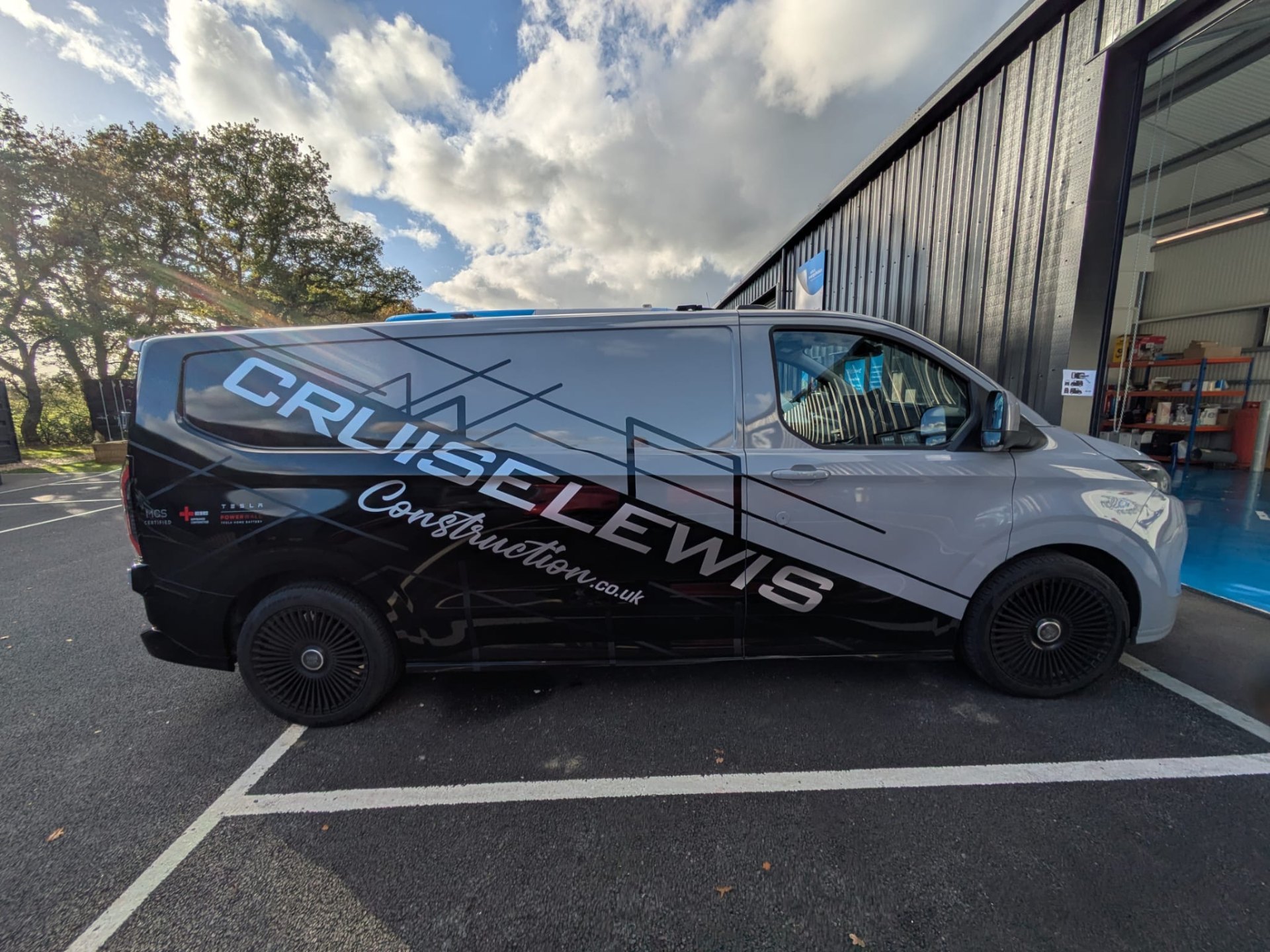 Cruise Lewis Construction van - side profile