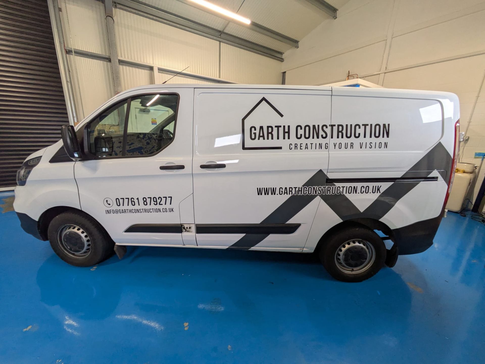 Garth Construction van demonstrating simple cut vinyl vehicle graphics