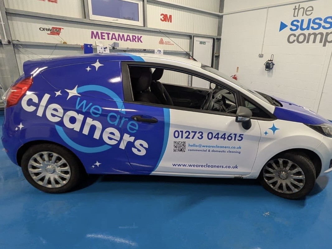 car showing a partial wrap for we are cleaners